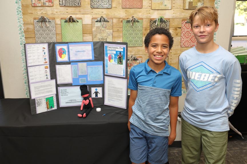  Students standing in front of their toy invention
